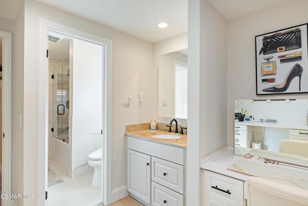 885 Rim Crest Drive Westlake Village, CA 91361 - Photo 13 of 35 a spacious bathroom with a double vanity sink a mirror and a shower