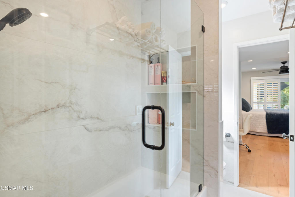 885 Rim Crest Drive Westlake Village, CA 91361 - Photo 14 of 35 a bathroom with a granite countertop shower and a sink