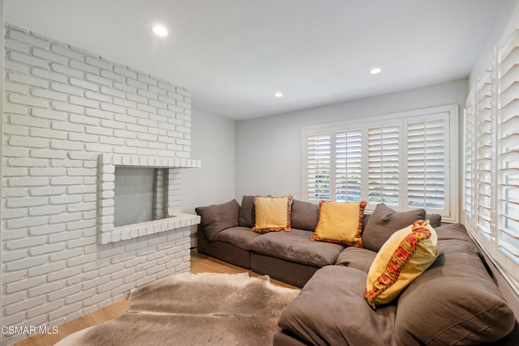 885 Rim Crest Drive Westlake Village, CA 91361 - Photo 27 of 35 a living room with furniture and a fireplace