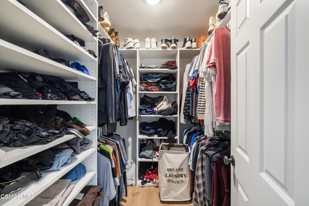 885 Rim Crest Drive Westlake Village, CA 91361 - Photo 28 of 35 a view of walk in closet with clothes and shoes