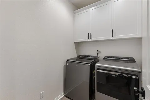 a white stove top oven sitting inside of a kitchen