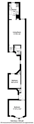 a view of a kitchen with refrigerator and white cabinets