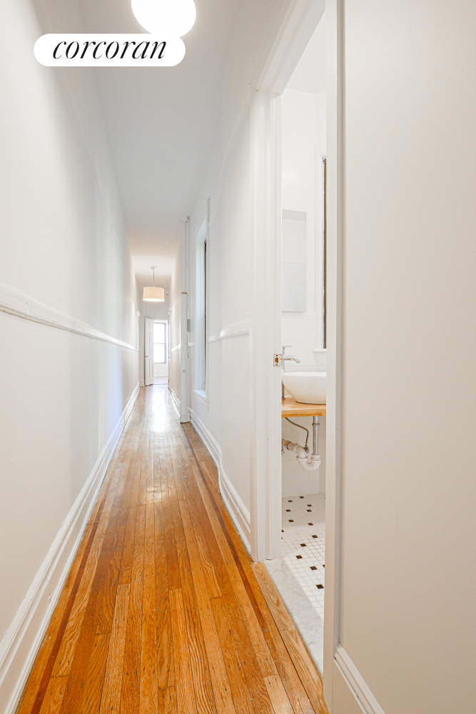 524 5th Street Brooklyn, NY 11215 - Photo 14 of 23 a view of a hallway with wooden floor