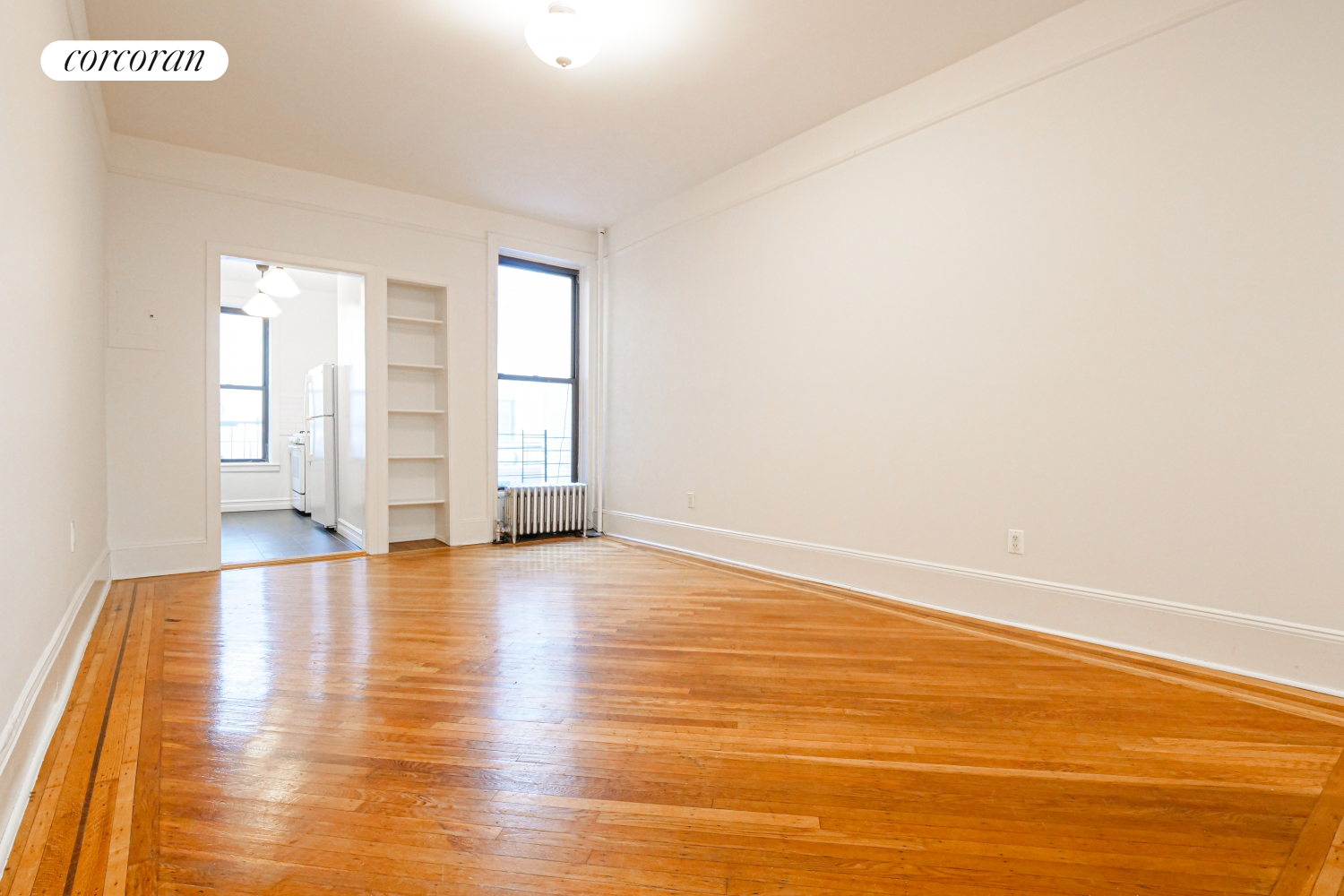 524 5th Street Brooklyn, NY 11215 - Photo 16 of 23 a view of empty room with wooden floor and fan