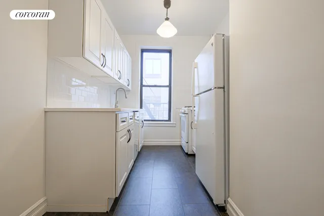a view of an empty room and wooden floor