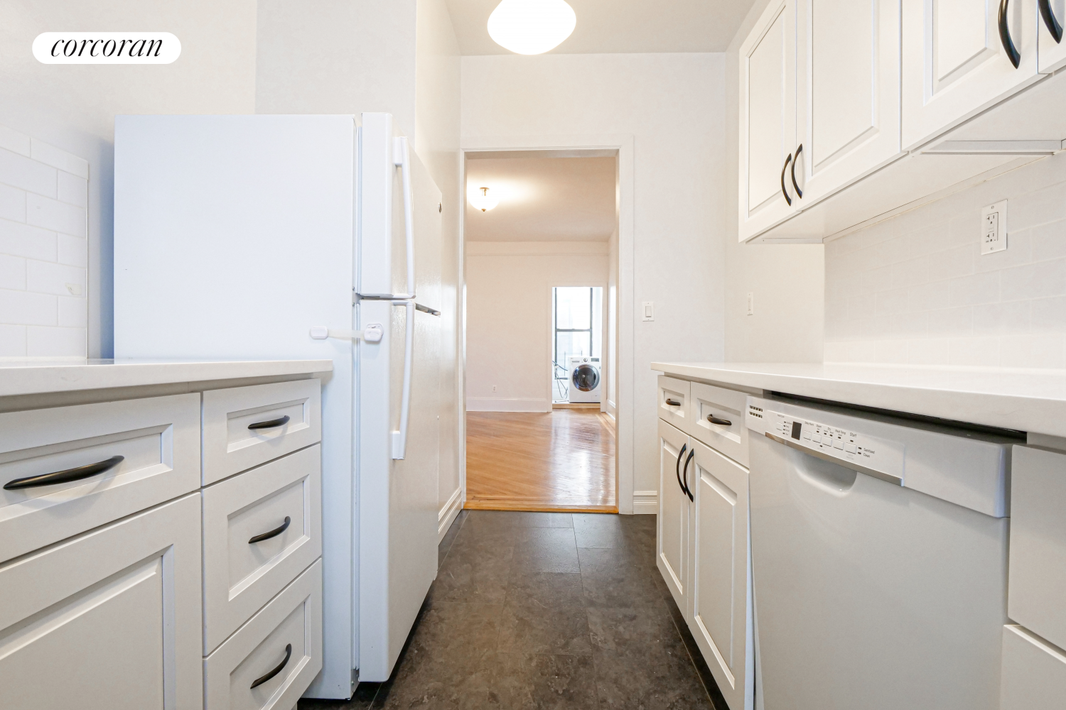 524 5th Street Brooklyn, NY 11215 - Photo 21 of 23 a view of a kitchen with refrigerator and white cabinets