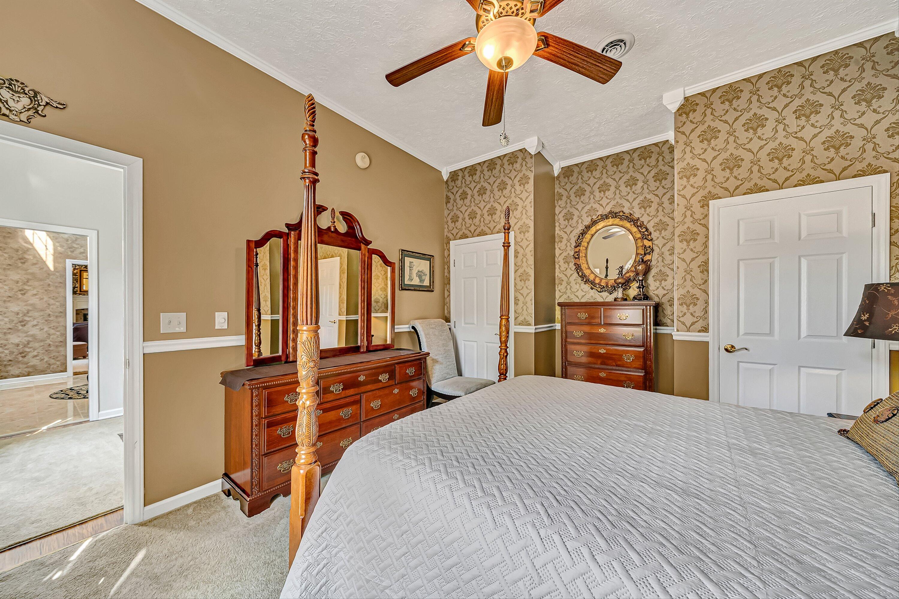 4723 Norwood Street Southwest Roanoke, VA 24018 - Photo 25 of 84 a bedroom with a bed a dresser and potted plants with the wooden floor
