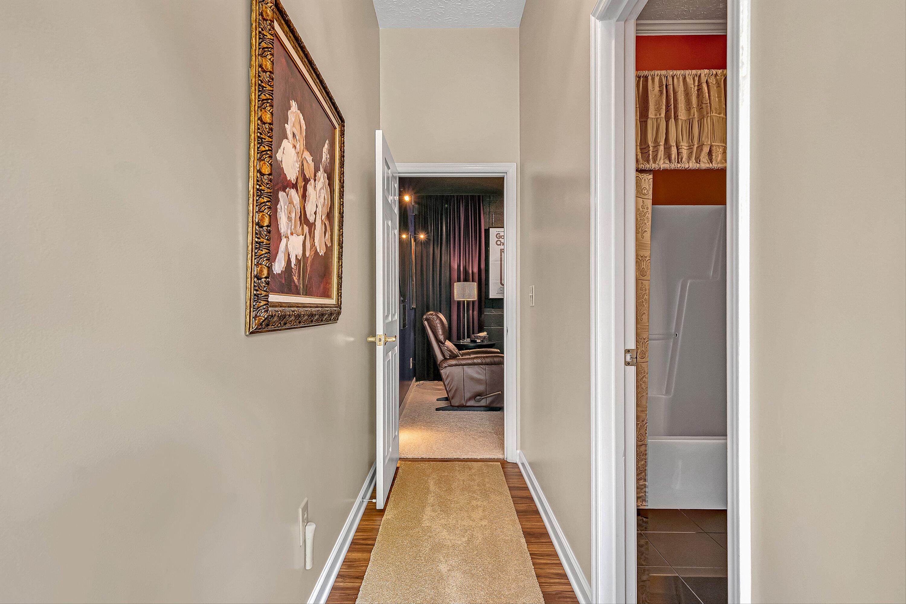 4723 Norwood Street Southwest Roanoke, VA 24018 - Photo 26 of 84 a view of a hallway with wooden floor and a living room
