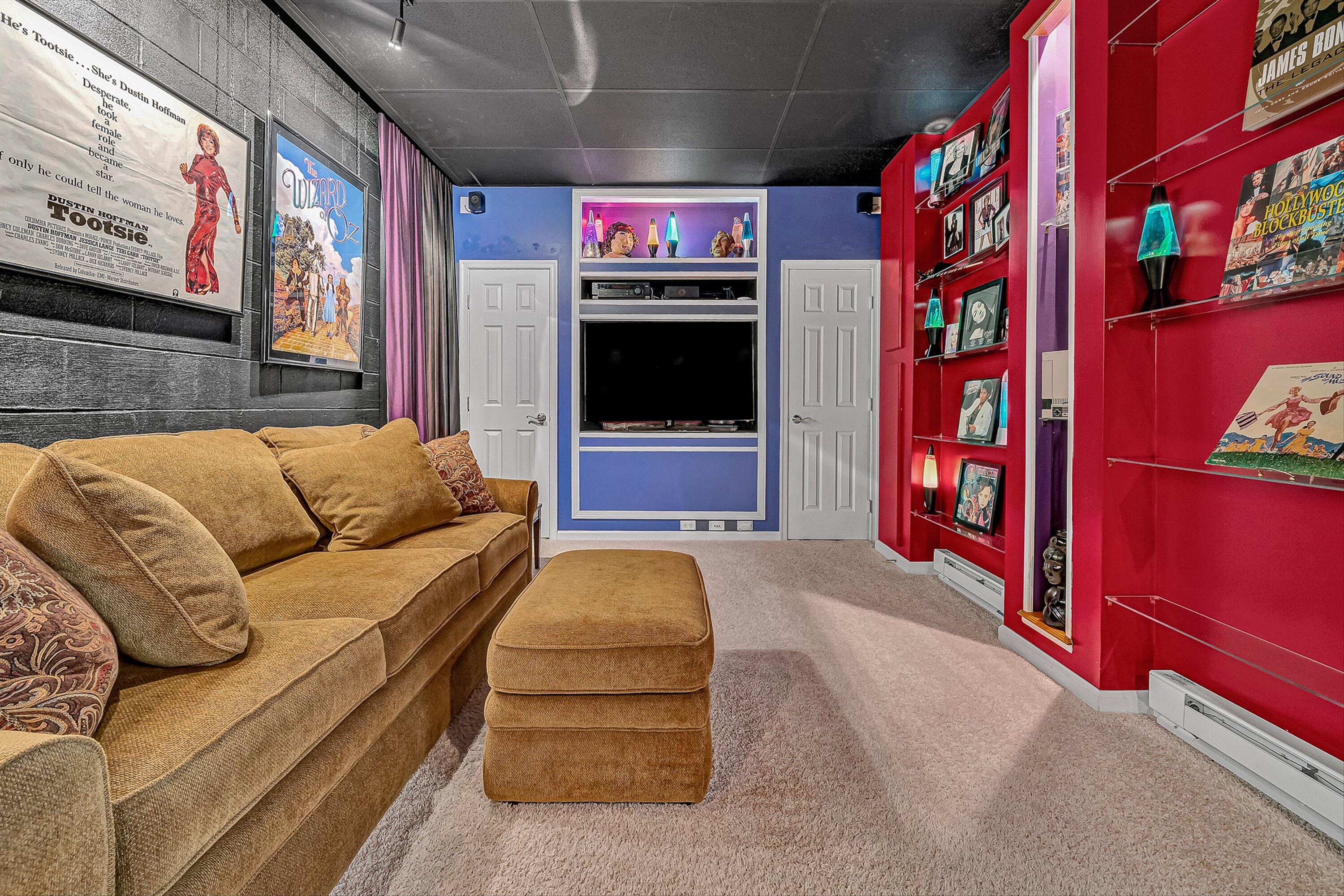 4723 Norwood Street Southwest Roanoke, VA 24018 - Photo 29 of 84 a living room with furniture gym equipment and a chandelier