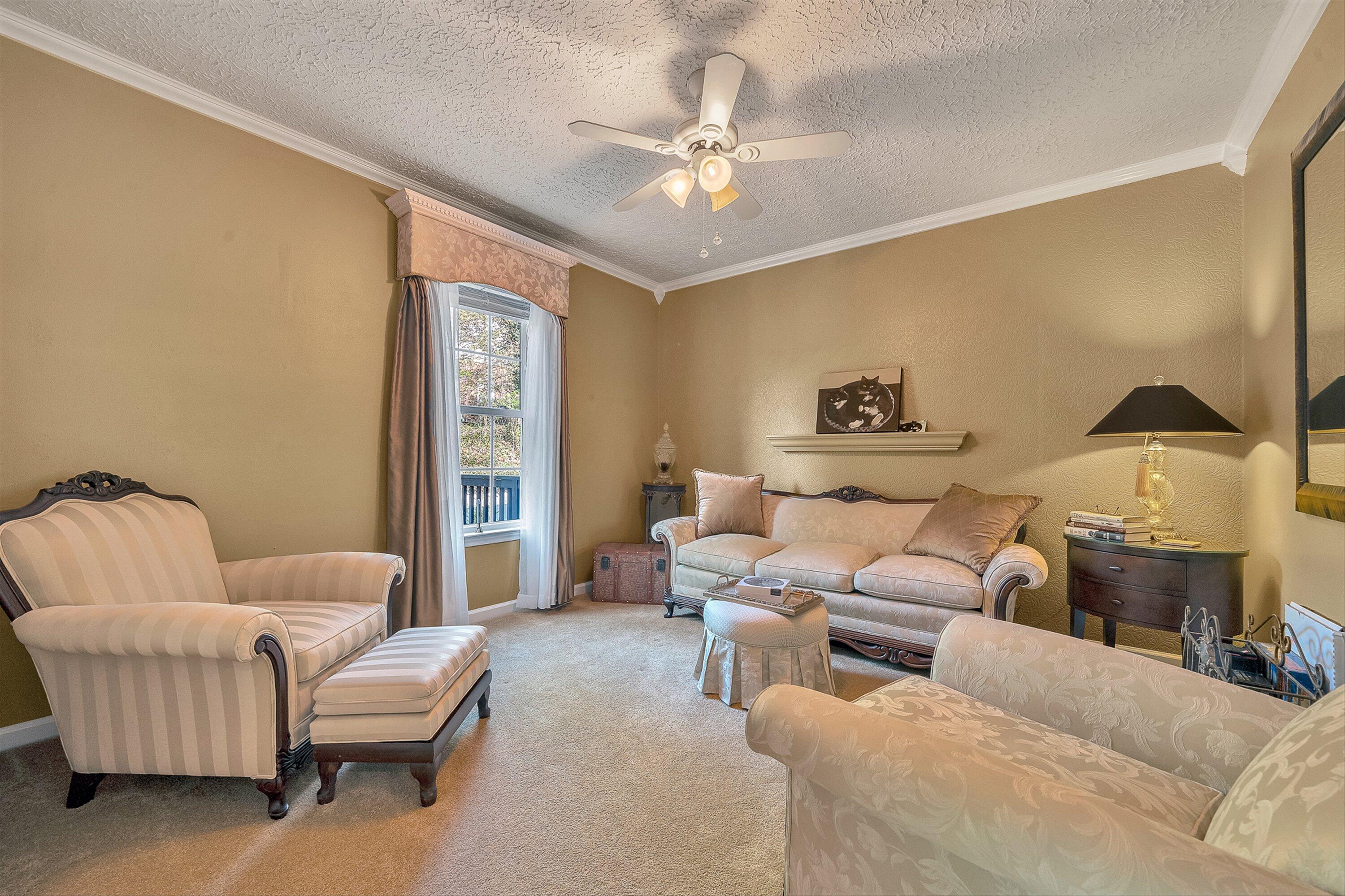 4723 Norwood Street Southwest Roanoke, VA 24018 - Photo 44 of 84 a living room with furniture and a chandelier