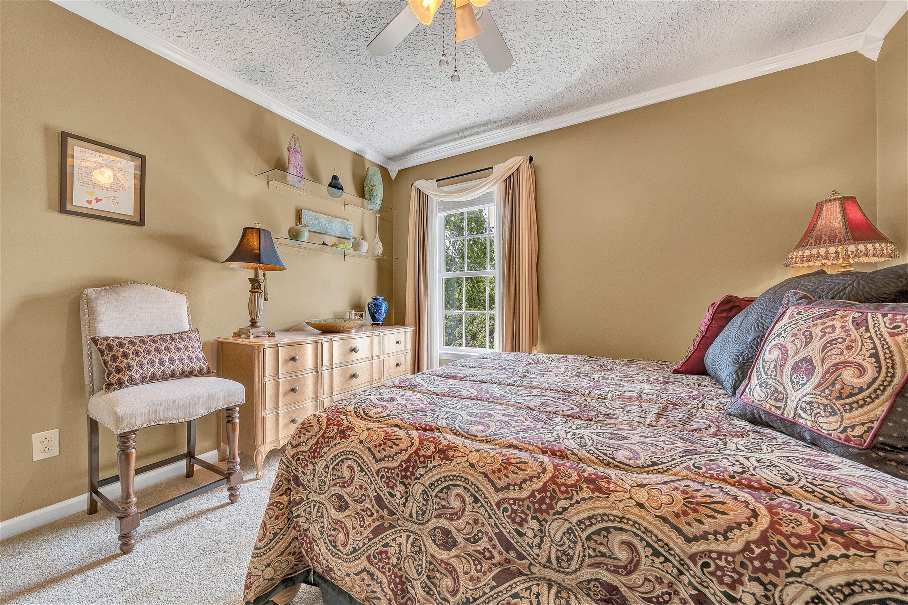 4723 Norwood Street Southwest Roanoke, VA 24018 - Photo 47 of 84 a bedroom with a bed and a chandelier