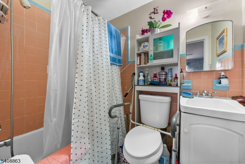 973 Ellis Parkway Edison, NJ 08820 - Photo 18 of 33 a white toilet sitting next to a bathroom sink