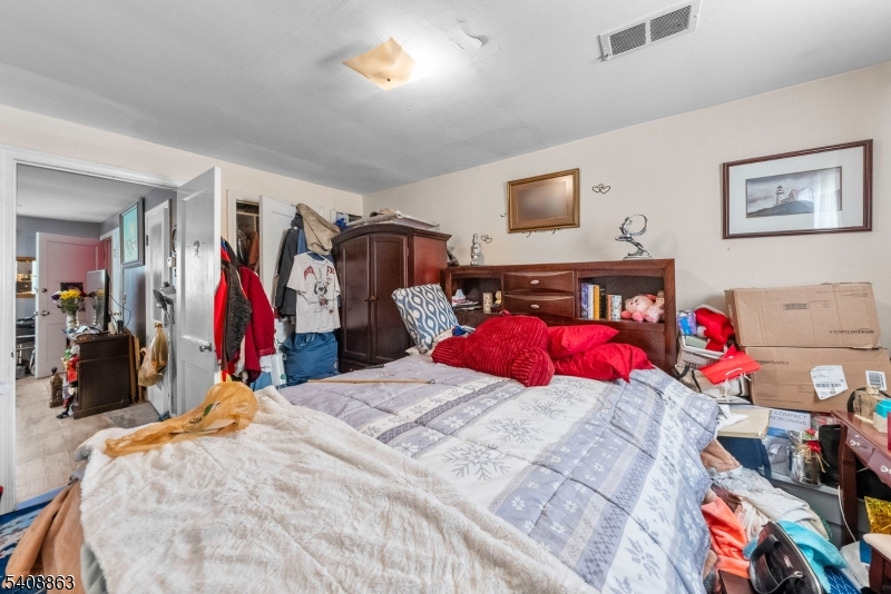 973 Ellis Parkway Edison, NJ 08820 - Photo 19 of 33 a bed room with a bed and a couch