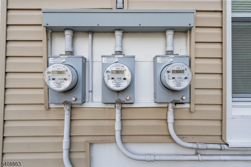 973 Ellis Parkway Edison, NJ 08820 - Photo 32 of 33 a clock on a wall next to a window