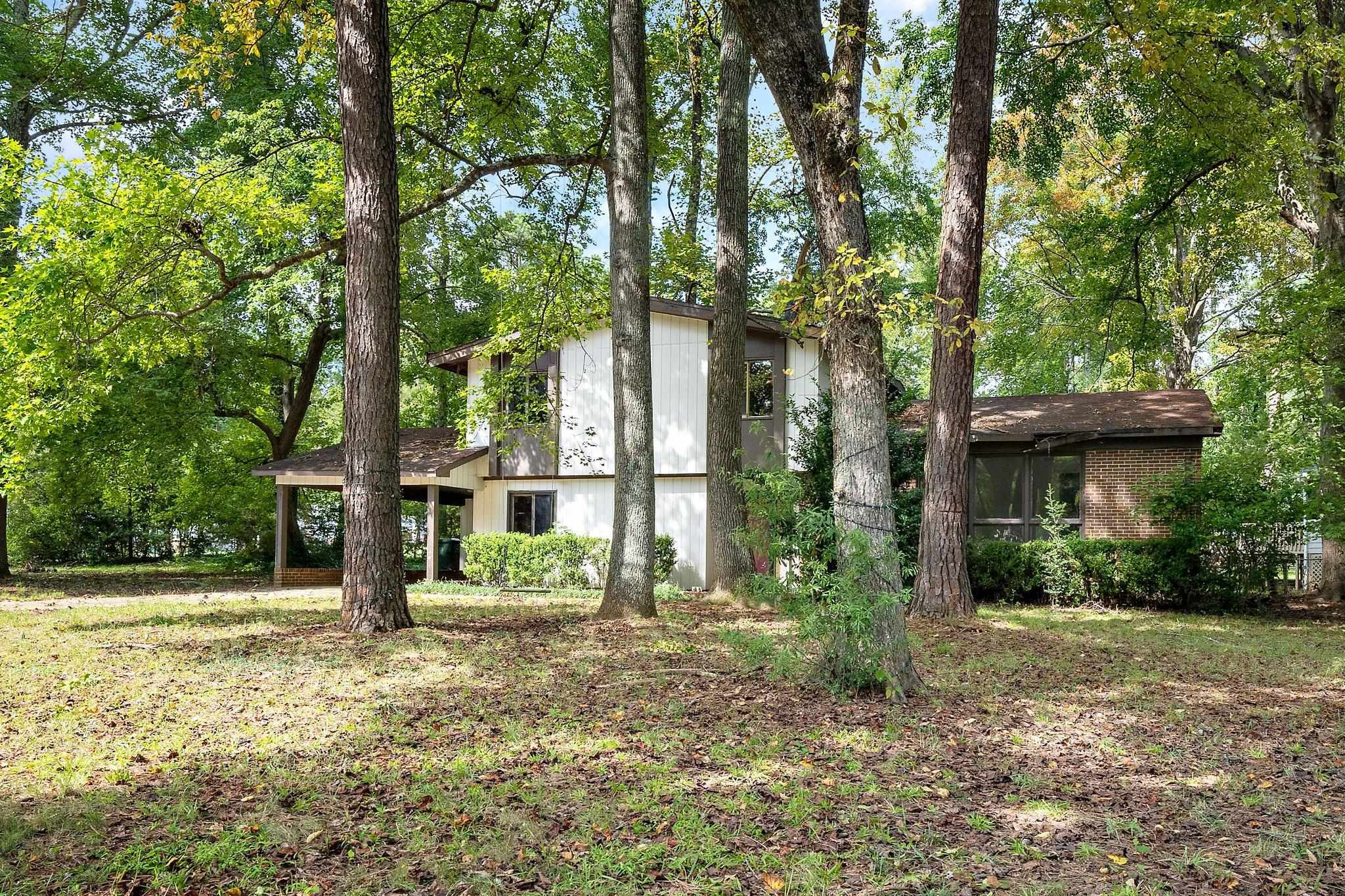 1307 Brookgreen Drive Cary, NC 27511 - Photo 1 of 26 a view of a house with a tree in front of a house