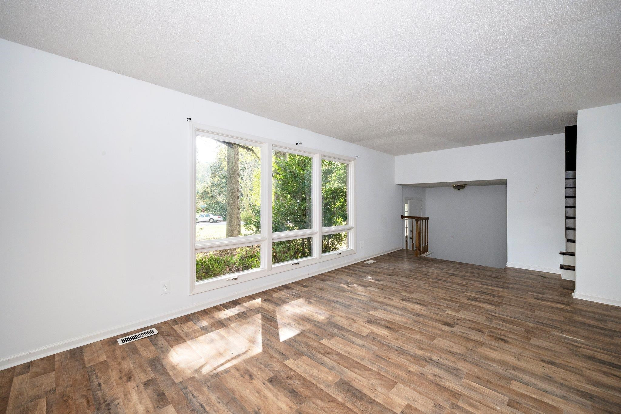 1307 Brookgreen Drive Cary, NC 27511 - Photo 11 of 26 a view of an empty room with a window