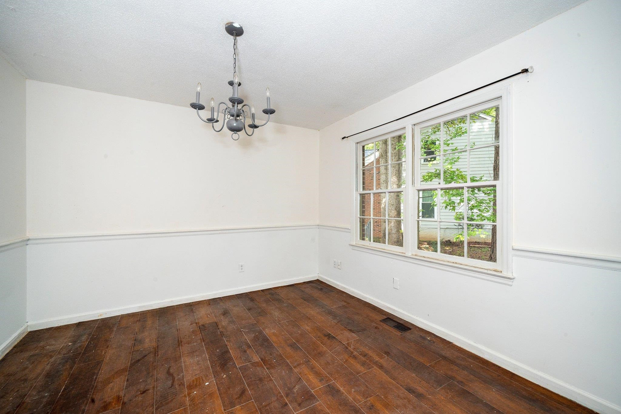 1307 Brookgreen Drive Cary, NC 27511 - Photo 12 of 26 wooden floor in an empty room with a window