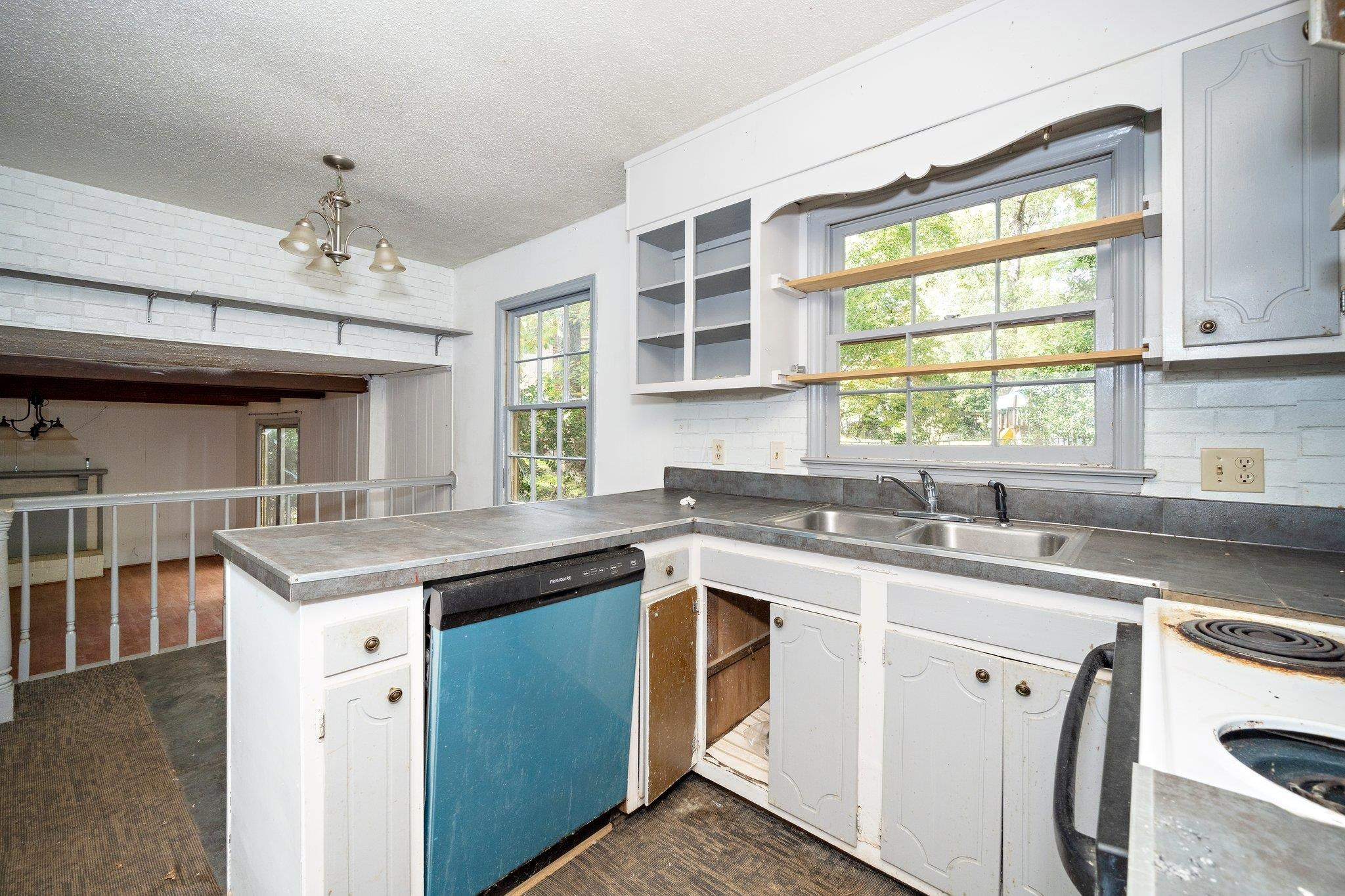 1307 Brookgreen Drive Cary, NC 27511 - Photo 14 of 26 a kitchen with a sink stove and window