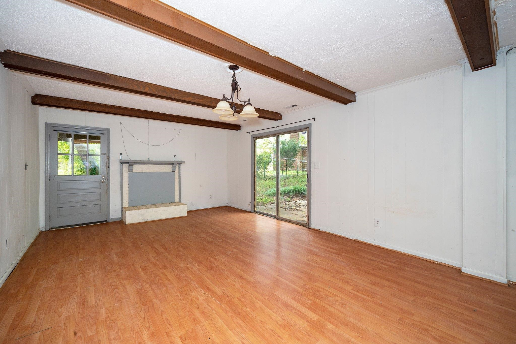 1307 Brookgreen Drive Cary, NC 27511 - Photo 21 of 26 a view of an empty room with wooden floor and a window