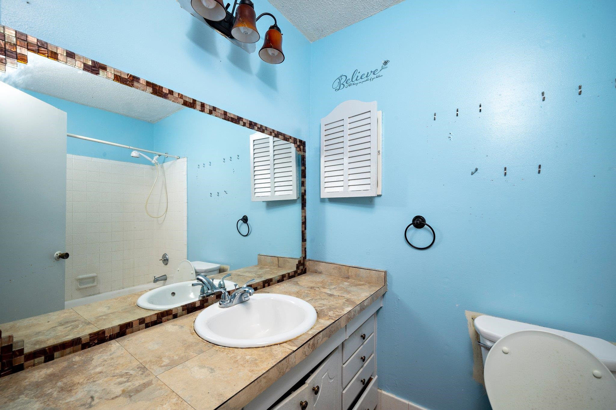 1307 Brookgreen Drive Cary, NC 27511 - Photo 23 of 26 a bathroom with a toilet sink and mirror