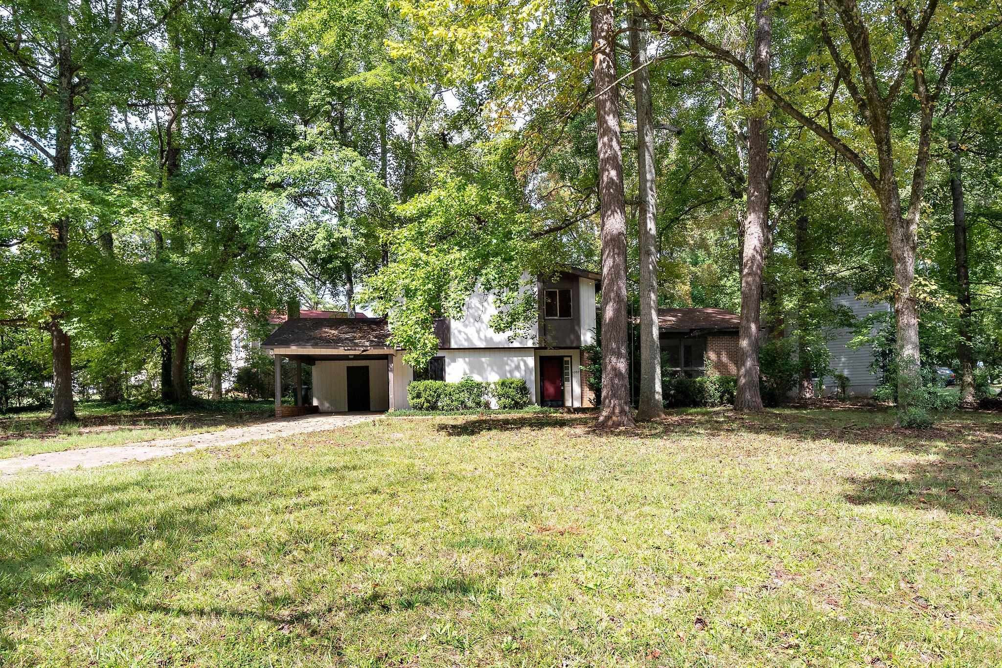 1307 Brookgreen Drive Cary, NC 27511 - Photo 25 of 26 a house with trees in the background