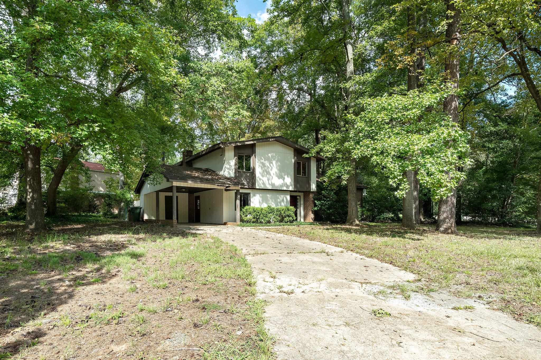 1307 Brookgreen Drive Cary, NC 27511 - Photo 26 of 26 a front view of a house with a yard and garage