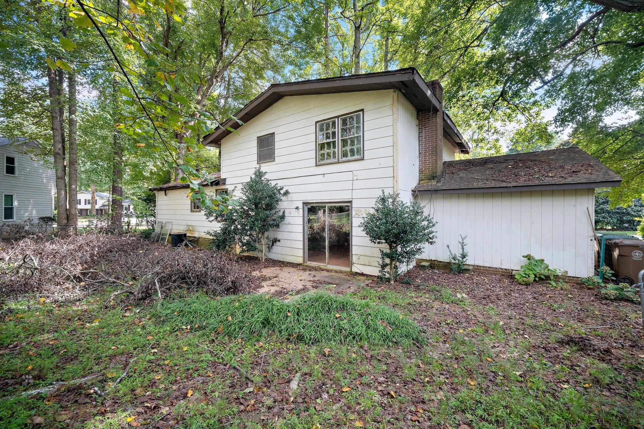 1307 Brookgreen Drive Cary, NC 27511 - Photo 4 of 26 a front view of a house with garden