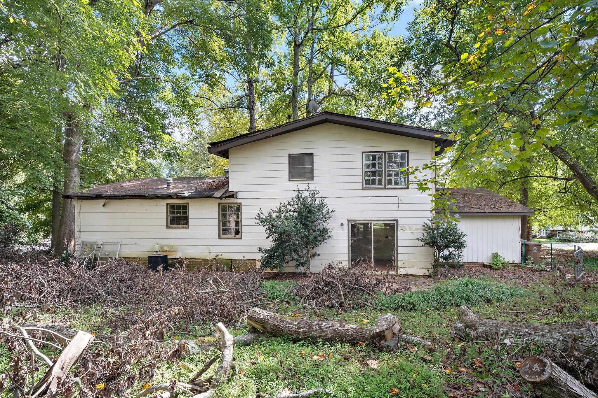 1307 Brookgreen Drive Cary, NC 27511 - Photo 5 of 26 a house that has a lot of plants in it