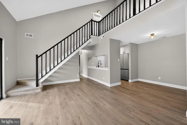 a view of an entryway with wooden floor