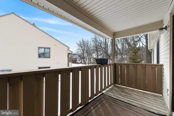 a balcony with wooden floor