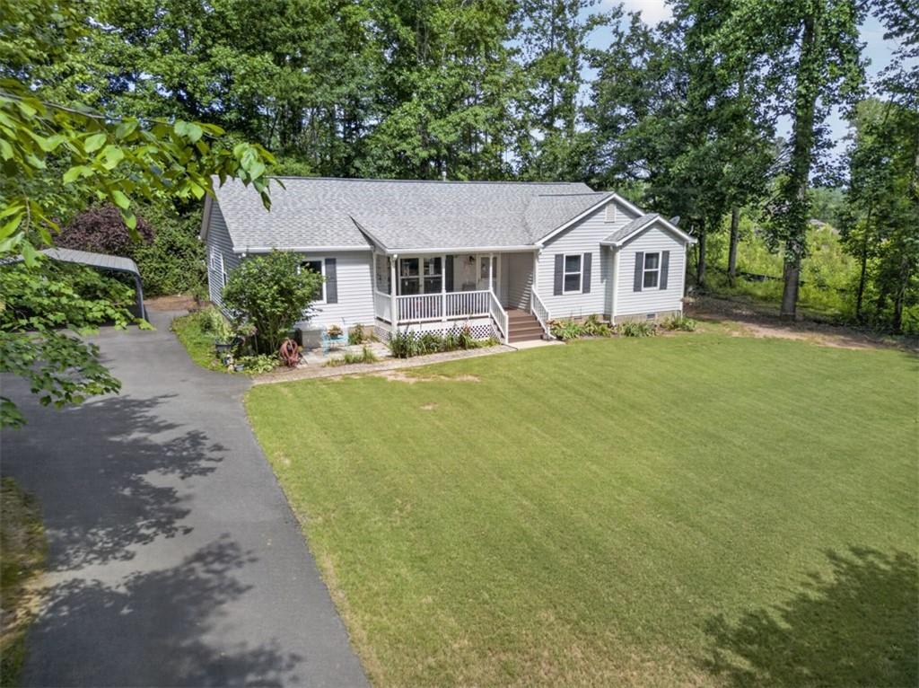3771 Castleberry Road Cumming, GA 30040 - Photo 60 of 69 a front view of a house with a garden