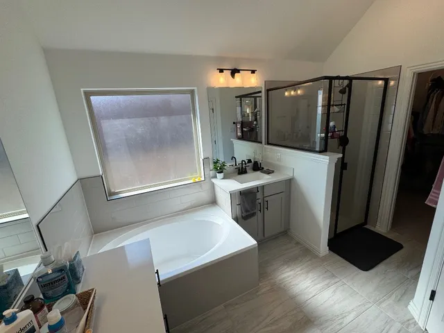 a room with furniture a rug and a window