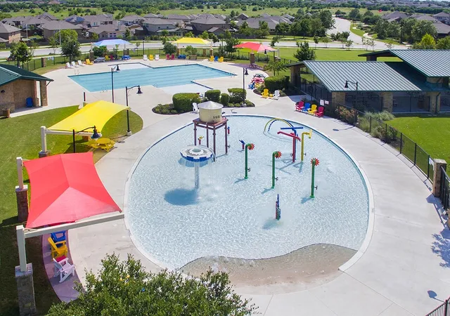 an aerial view of a house with swimming pool