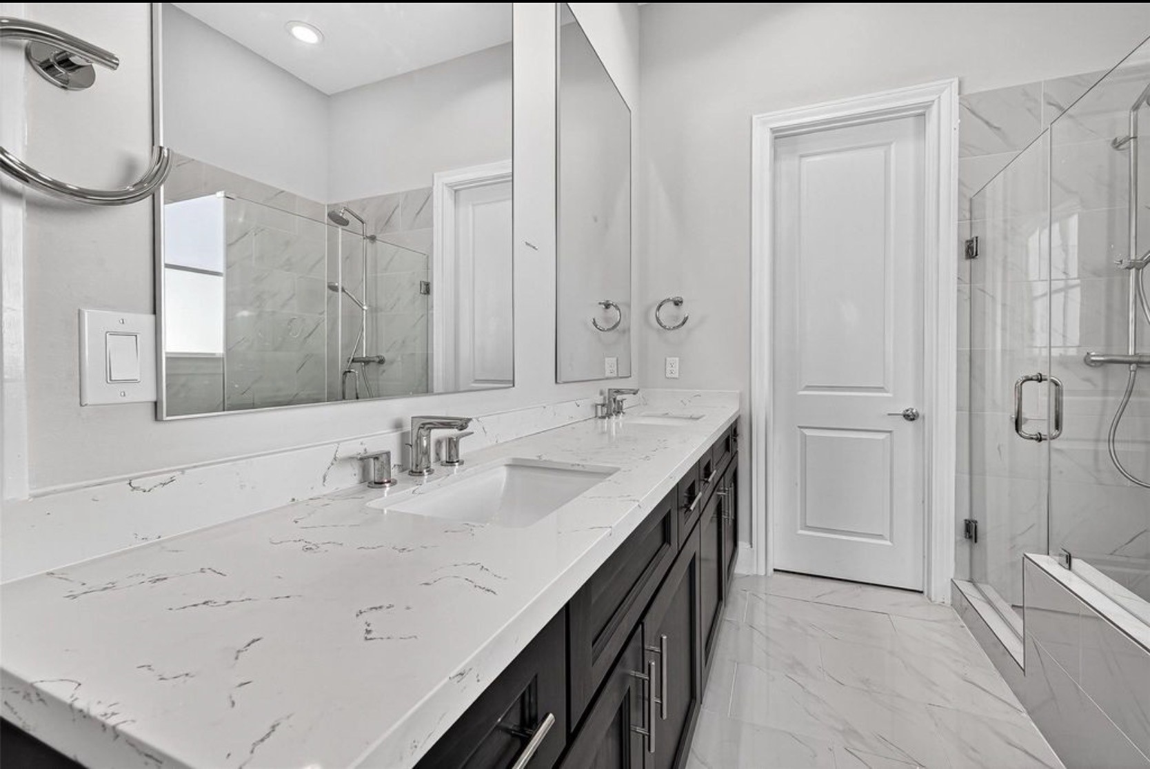 815 Bringhurst Street Houston, TX 77020 - Photo 12 of 15 a bathroom with a double vanity sink a mirror and a bathtub