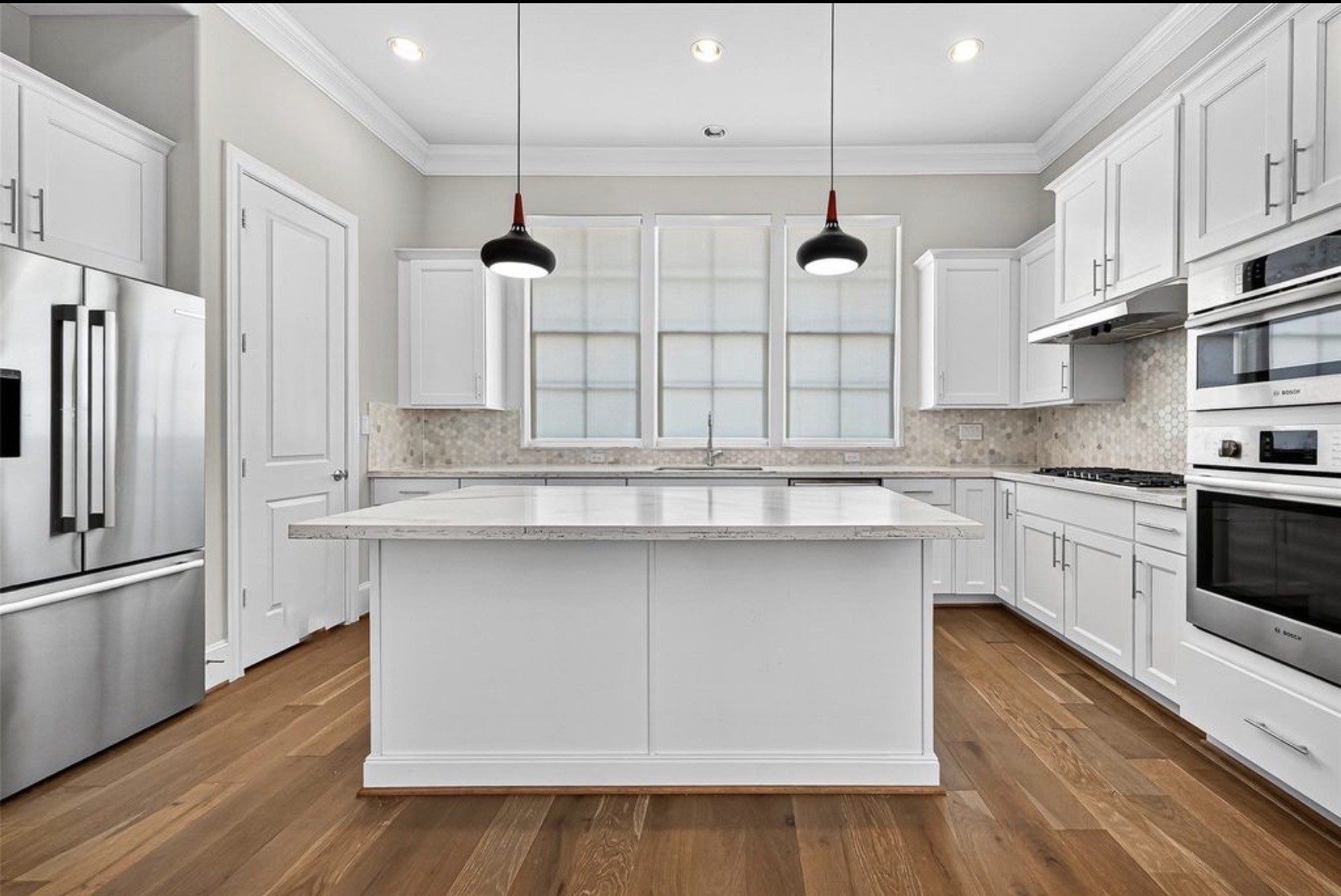 815 Bringhurst Street Houston, TX 77020 - Photo 8 of 15 a kitchen with stainless steel appliances granite countertop a sink a stove and a refrigerator