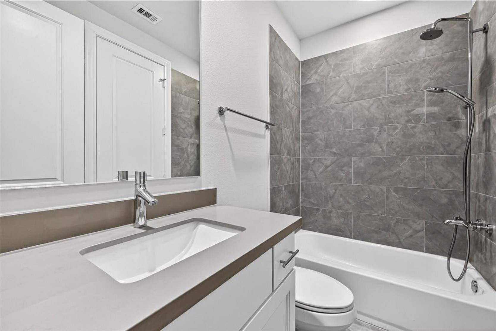 815 Bringhurst Street Houston, TX 77020 - Photo 10 of 15 a bathroom with a sink toilet vanity and shower