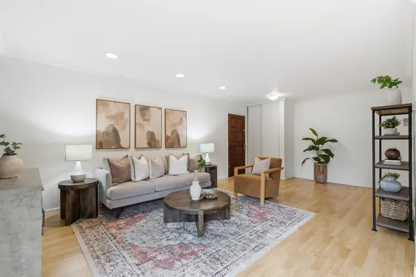 a living room with furniture rug and window
