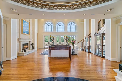 a view of a dining room with furniture wooden floor and a chandelier