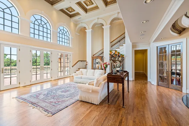 a living room with fireplace furniture and a book shelf