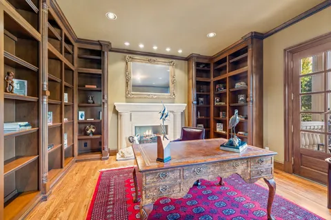 a living room with furniture and wooden floors