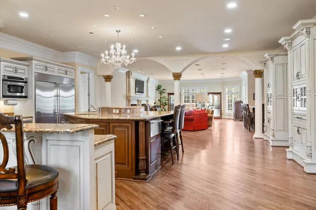 a bedroom with a bed and a television