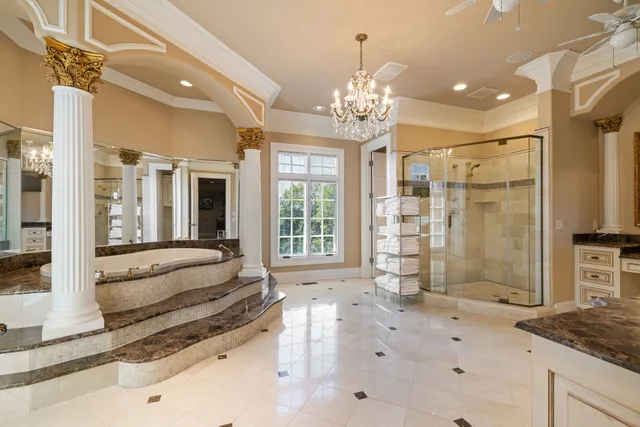 a group of people sitting in a room with kitchen view