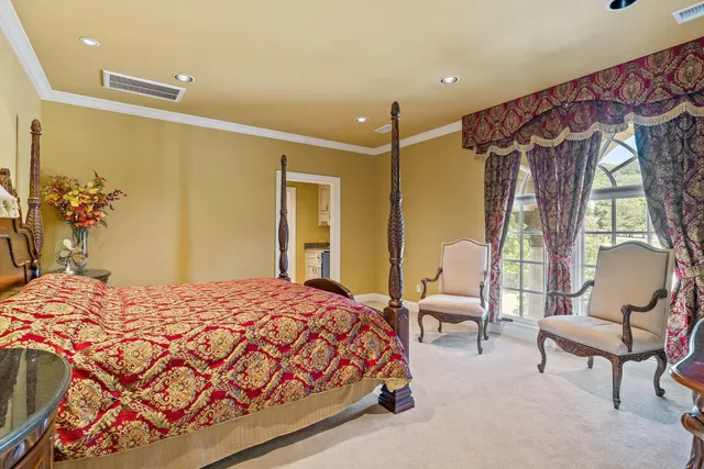 a kitchen with granite countertop a sink stove and refrigerator