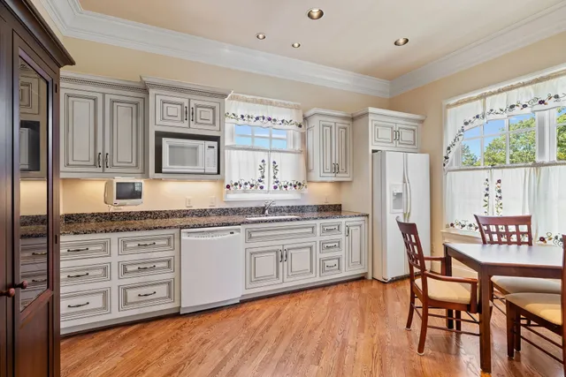 a view of a yard with large trees