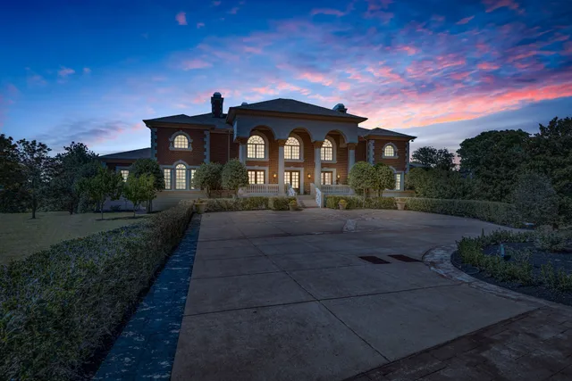 a living room with fireplace furniture and a wooden floor