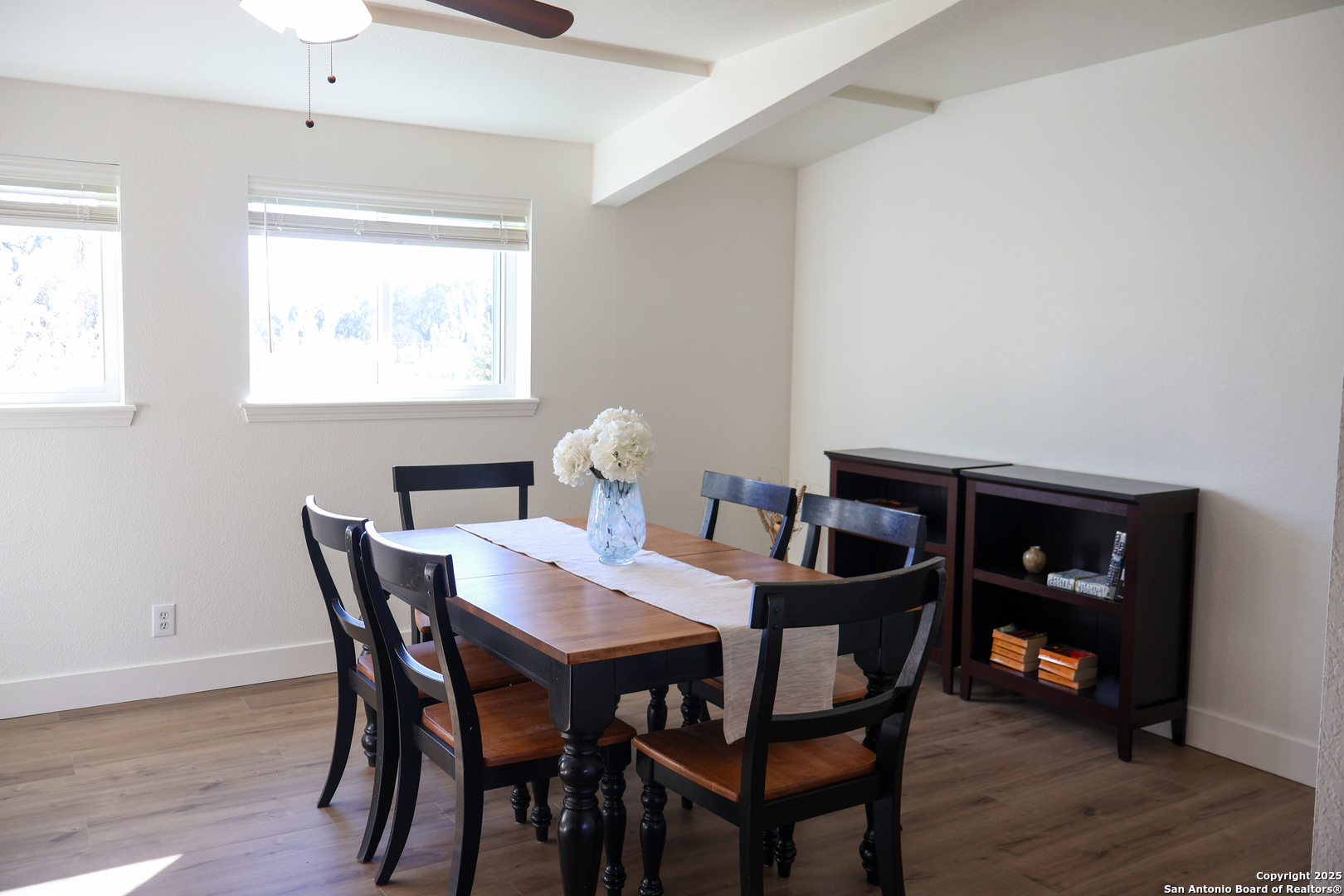 1031 Shin Oak Road Menard, TX 76859 - Photo 13 of 31 a view of a dining room with furniture and wooden floor