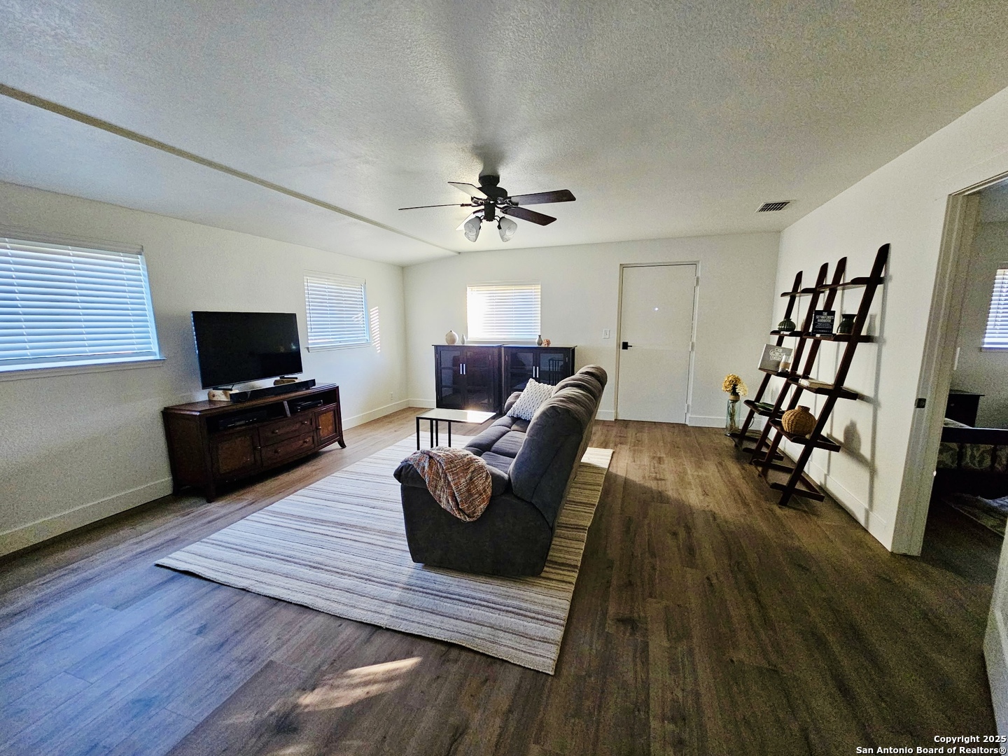 1031 Shin Oak Road Menard, TX 76859 - Photo 14 of 31 a living room with furniture and a flat screen tv