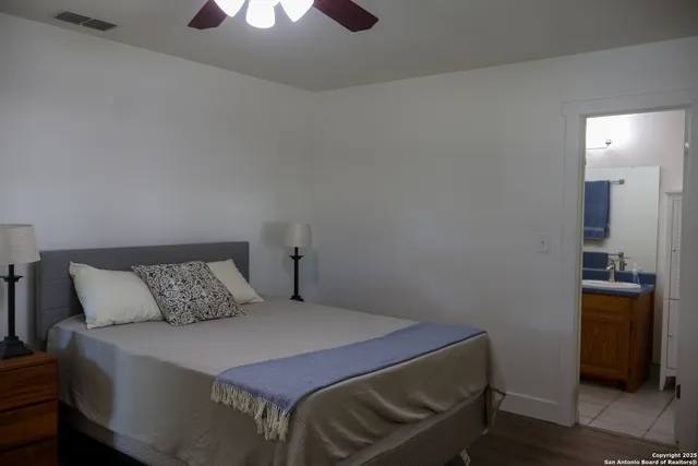 a bedroom with a bed and a dresser