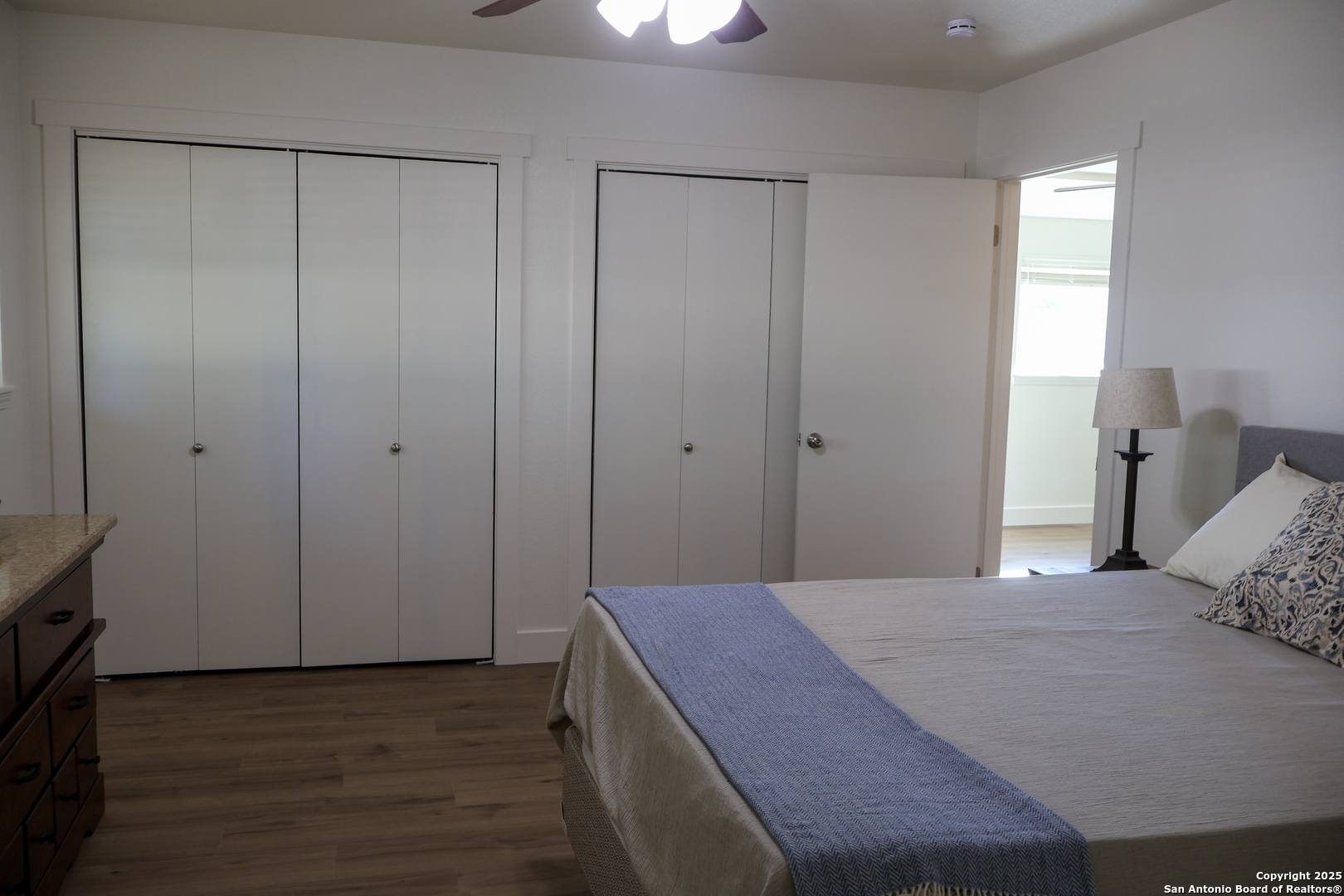 1031 Shin Oak Road Menard, TX 76859 - Photo 19 of 31 a bedroom with a bed and a dresser