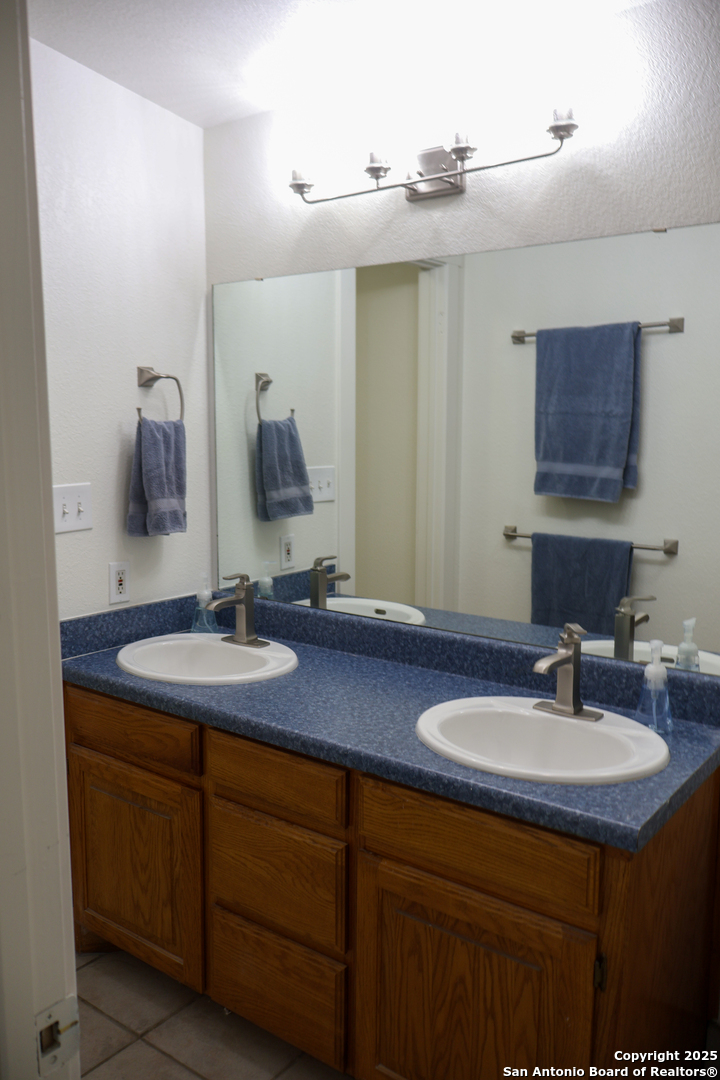 1031 Shin Oak Road Menard, TX 76859 - Photo 20 of 31 a bathroom with a sink and a mirror